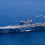 India's maritime doctrine: INS Vikrant aircraft carrier with fighter jets in the Indian Ocean